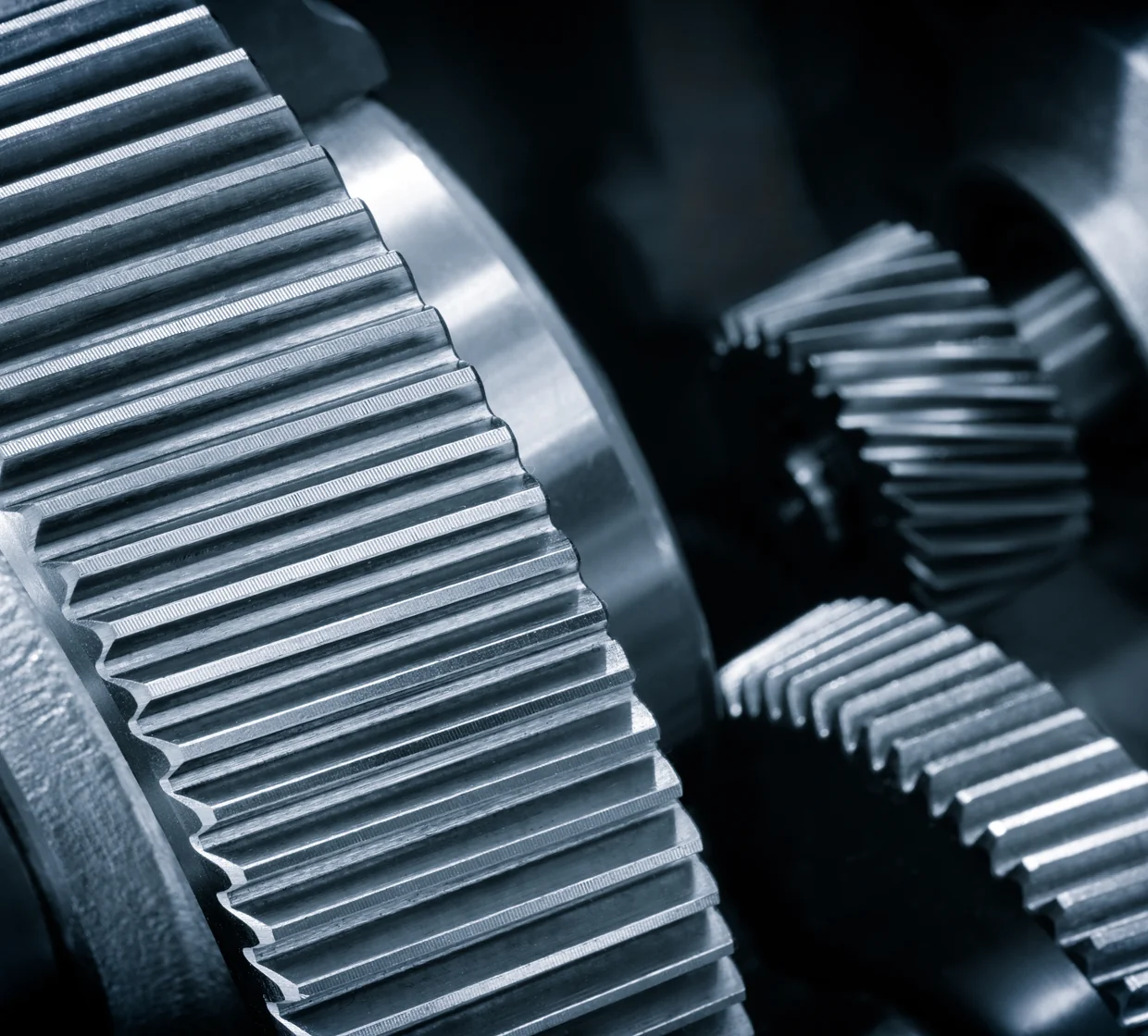 Meshing helical gears inside an industrial gearbox